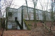 The shooting bunker was hidden in the forest opposite the barracks.